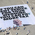 Activists from the UK action group Everyone hates Elon and Greenpeace Italy unfolded a giant 20x20m banner reading “If you can rent Venice for your wedding, you can pay more tax” on Piazza San Marco, as Jeff Bezos is due to celebrate his reportedly multi-million wedding in the lagoon city this week.