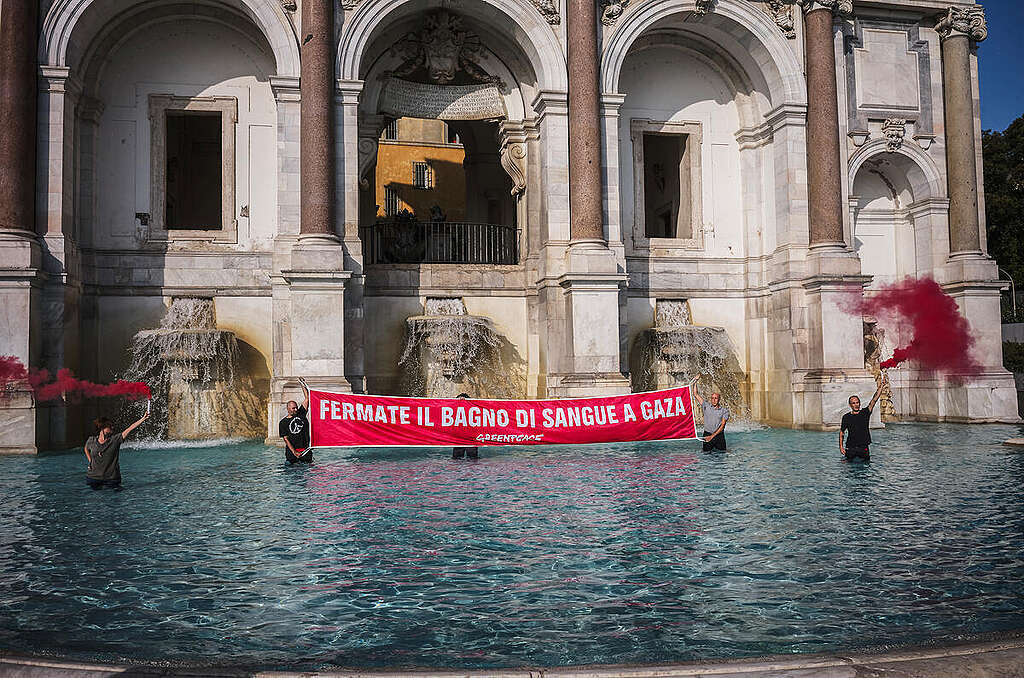 Activists from Greenpeace Italy have unfurled a blood-red banner in the Acqua Paola fountain on the Gianicolo in Rome with the words Activists from Greenpeace Italy have unfurled a blood-red banner in the Acqua Paola fountain on the Gianicolo in Rome with the words