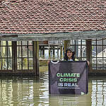 Greenpeace Indonesia Chasing The Shadow (CATS) team hold a photo ops by spreading the banner in the middle of Timbulsoko village which about thirty years ago was surrounded by agriculture area then gradually changed and became fishponds and today is totally submerged by the sea water due to the rising sea levels in conjunction with the land subsidence and climate change in north coast of Sayung Sub-district, Demak Regency, Central Java, Indonesia.
Greenpeace Indonesia holds a Chasing The Shadow (CATS) bicycle tour from Jakarta to Bandung, Semarang, Surabaya and finish in Bali to bearing witness the climate crisis impacts in Indonesia.