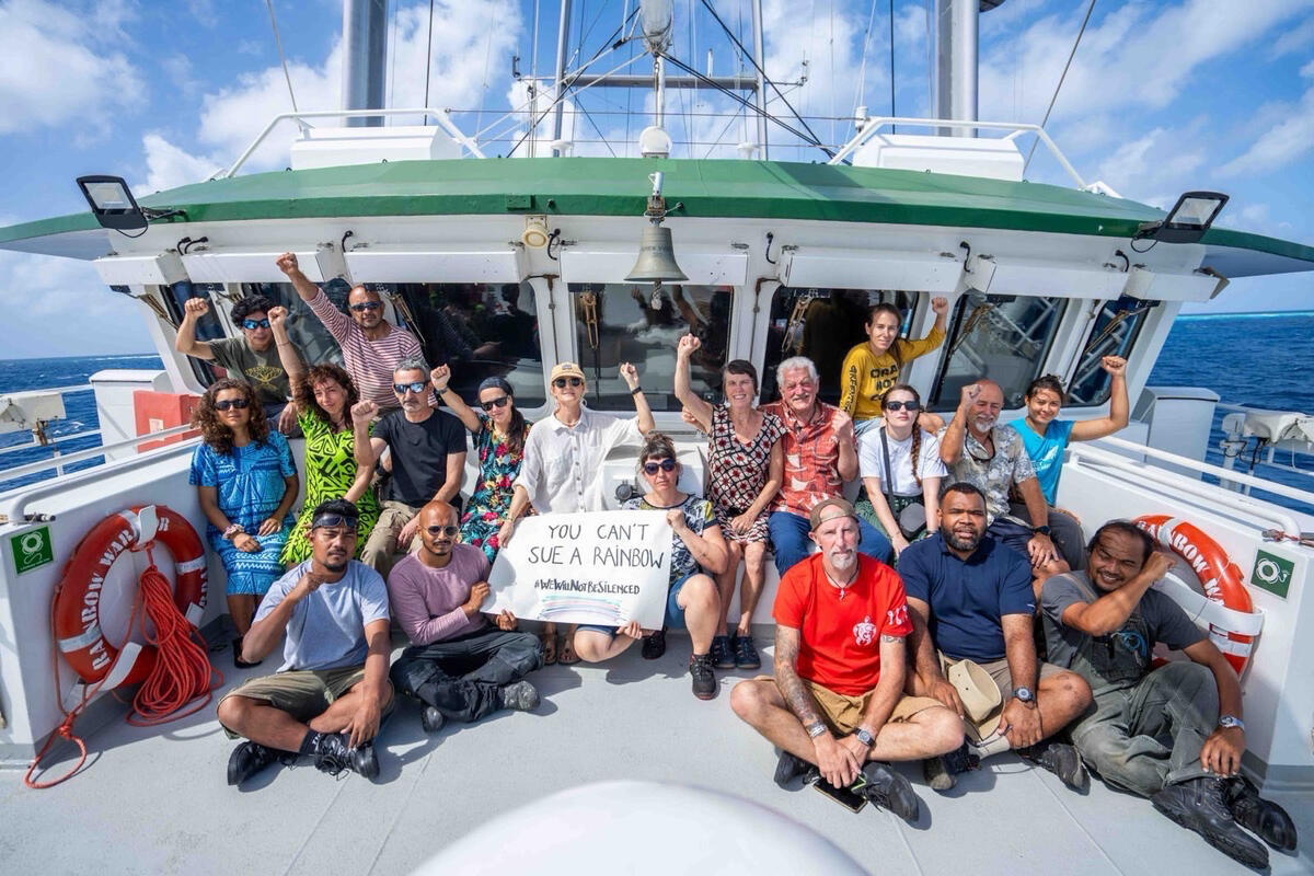 Rainbow Warrior's Crew with Banner 'You Can't Sue A Rainbow' in the Marshall Islands. © Greenpeace / Chewy C. Lin Rainbow Warrior's Crew with Banner 'You Can't Sue A Rainbow' in the Marshall Islands. © Greenpeace / Chewy C. Lin