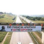 Greenpeace Africa activists hung a giant banner with a photo of South African president Cyril Ramaphosa reading 'End Financial Apartheid #TaxTheSuperRich', ahead of the G20's 3rd Finance Ministers and Central Bank Governors’  meeting in Durban. Greenpeace is demanding the G20 host push ahead on accelerating efforts to impose a wealth tax on the world’s billionaires and to support the UN Tax Convention for new and fair global tax rules.