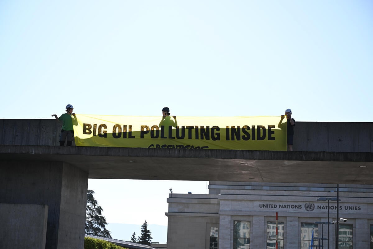 Greenpeace activists paint Geneva streets black to call out Big Oil’s chokehold on Global Plastic Treaty talks, demand UN kicks out fossil fuel lobbyists