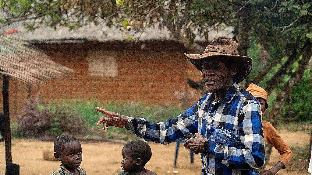 Local man talking to children. Local man talking to children.