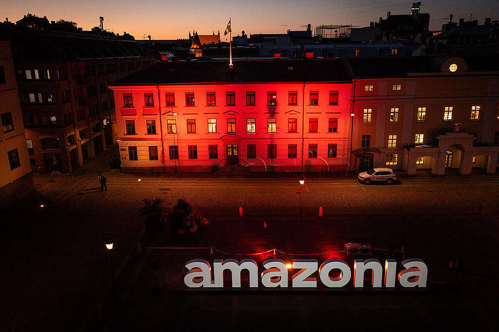 "Amazonia" travelling letters projection show at Gustaf-Adolfs Square in Gothenburg. Greenpeace brings the Amazon to the heart of Europe through a powerful street-level action: giant AMAZONIA letters touring major cities. Through emotional messages, video projections, and Indigenous voices, the action calls for urgent climate justice and forest protection — ahead of the historic COP30 in Belém. © Will Rose / Greenpeace "Amazonia" travelling letters projection show at Gustaf-Adolfs Square in Gothenburg. Greenpeace brings the Amazon to the heart of Europe through a powerful street-level action: giant AMAZONIA letters touring major cities. Through emotional messages, video projections, and Indigenous voices, the action calls for urgent climate justice and forest protection — ahead of the historic COP30 in Belém. © Will Rose / Greenpeace