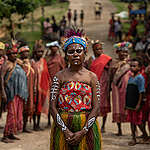 Women from the Papuan indigenous community prepare for a welcome dance at the ceremony for the Forest Defender Camp participants in Sira Village, Saifi district, South Sorong Regency, Southern West Papua. Greenpeace Indonesia hold a Forest Defender Camp to train Indigenous Peoples’ youth from various communities to protect the Papuan forest in Papua Island.