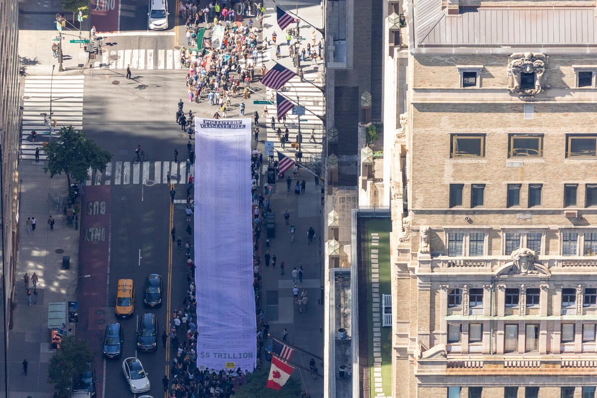 Greenpeace USA unveils giant “bill” with the economic damages brought on by five major oil and gas companies at NYC Climate Week