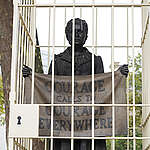 A team of Greenpeace activists install prison bars around three iconic statues - Nelson Mandela, Mahatma Gandhi and the Suffragist Millicent Fawcett -  in Parliament Square. The installation is a protest against the UK government’s crackdown on protest, implemented through the proscription of Palestine Action, and new powers for police to clamp down on protesters including in the Crime and Policing Bill that is currently being debated in Parliament. These famous protesters could fall foul of the government’s anti-protest laws and be branded as criminals if they were still protesting today, despite being celebrated as heroes at the heart of Westminster.