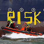 Polish, Ukrainian and other activists paint a Russian 'shadow fleet' tanker in the Baltic Sea off Rostock.