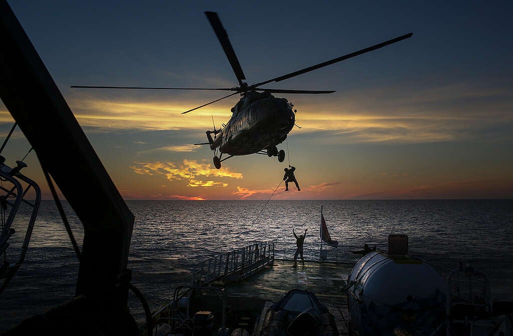 Russian special forces seize the Arctic Sunrise at gunpoint © Denis Sinyakov / Greenpeace
