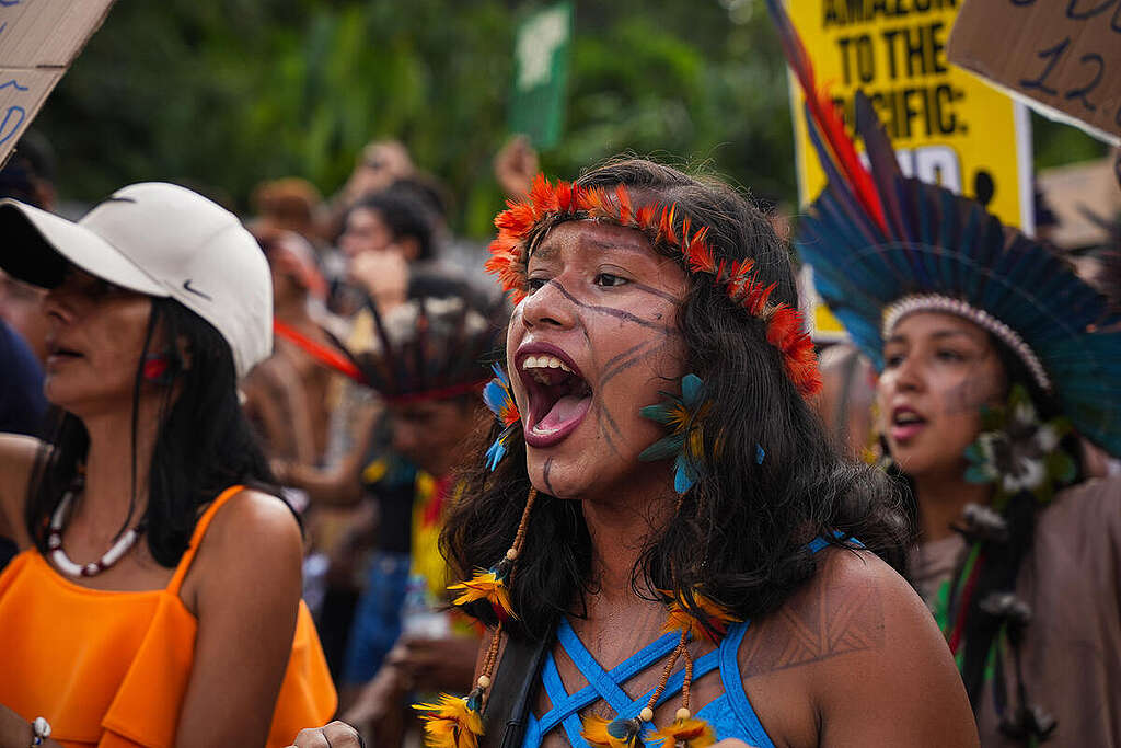 Indigenous woman shouts a protest chant during a colourful march outside COP30 in Belém. © Filipe Bispo / Greenpeace Indigenous woman shouts a protest chant during a colourful march outside COP30 in Belém. © Filipe Bispo / Greenpeace