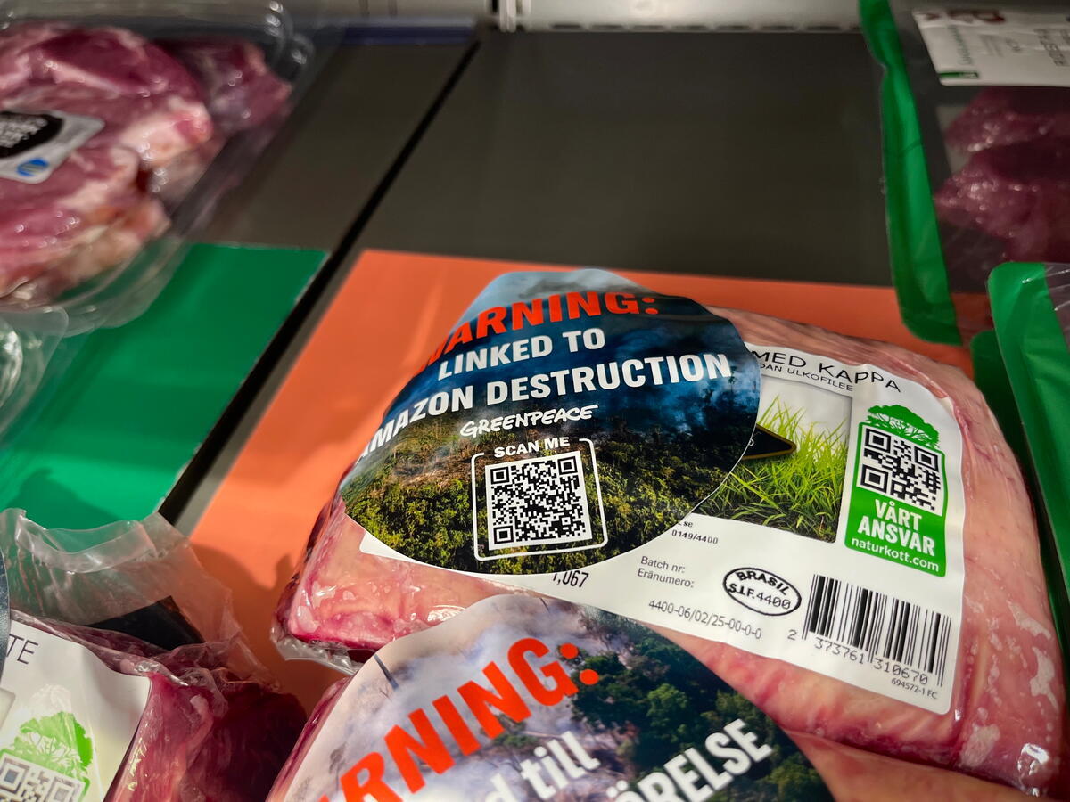 JBS Warning Stickering Activity in Stockholm. © Ludvig Tillman / Greenpeace