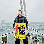 Actor Philip Froissant (in the picture) and content creator Fabian Grischkat join Greenpeace Germany and the European 'Fossil-Free Future' campaign to visit gas facilities in Germany with the Greenpeace sailing boat ‚Witness‘: the fossil gas drilling project of the Dutch energy company One-Dyas around 20 kilometres northwest of Borkum in the North Sea, and the LNG import terminal in Wilemshaven.