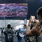 Greenpeace projected recent global extreme weather events in Belem to send a message to delegates that the time for action is now.