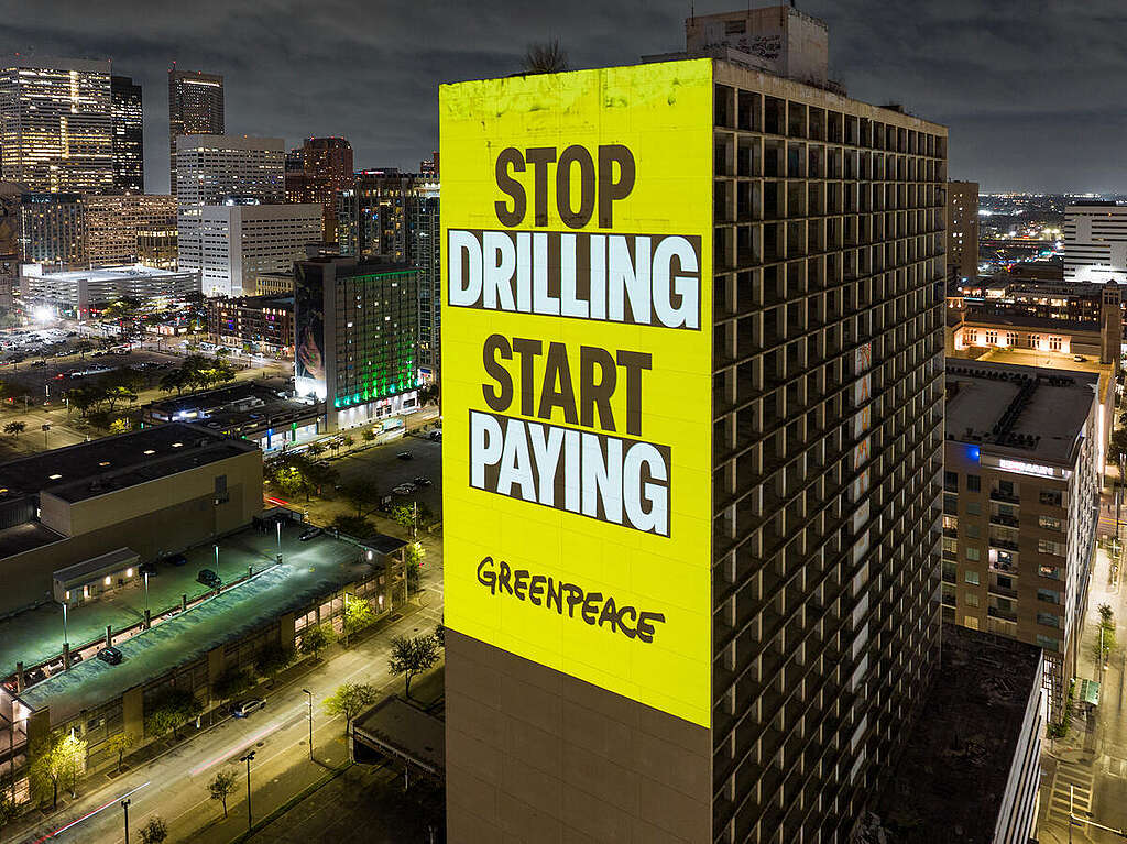 A bold “Make Polluters Pay” projection lit up Houston during CERAWeek—the fossil fuel industry’s so-called “Super Bowl”—calling out Big Oil for its central role in driving the climate crisis. The campaign demands that the industry not only be held accountable for past damage, but also be forced to fund the costs of preparing our communities for the escalating impacts of climate change. © Greenpeace