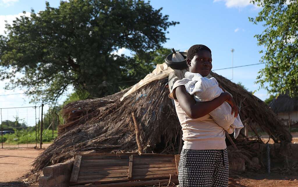 Evidence Ramoshaba holds her baby Kutshemba after giving birth amid heavy flooding in Mbaula village, Giyani, in Limpopo.