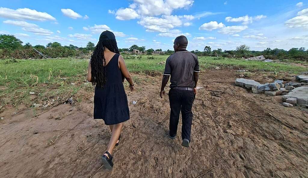 Sipho Dzambukeri leads Daily Maverick journalist Lerato Mutsila through the devastated landscape of Mbaula Village in Giyani, Limpopo.