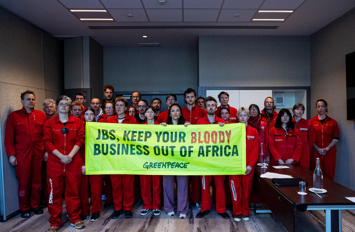 Greenpeace Netherlands Activists Disrupt JBS Shareholders’ Meeting in Amsterdam. © Marten  van Dijl / Greenpeace
