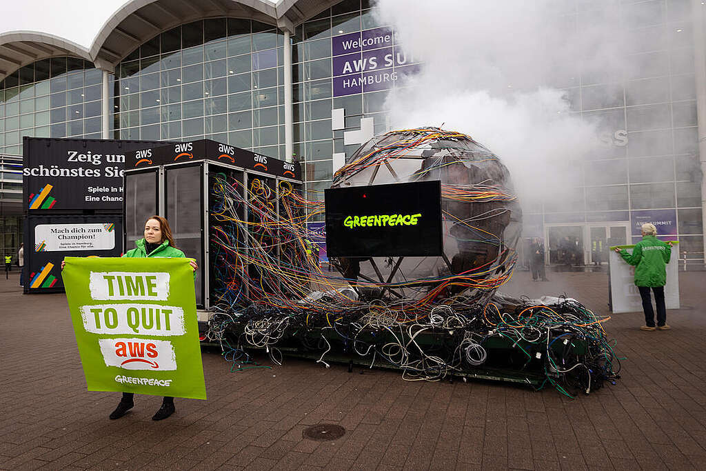 Protest with Sculpture and Banner against Amazon&acute;s Cloud Provider 