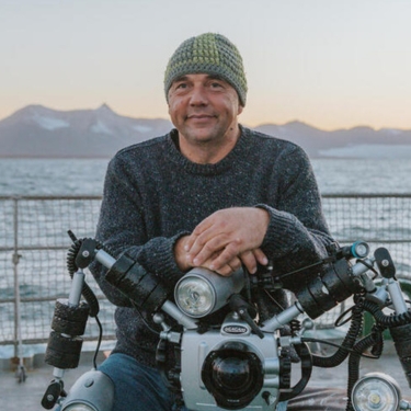 Photographer Solvin Zankl on the Arctic Sunrise in the Arctic. &copy; Bianca Vitale / Greenpeace