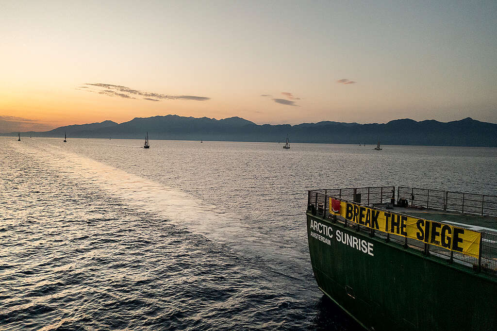 Greenpeace ship Arctic Sunrise displays a banner saying Break the Siege. A number of smaller Global Sumud Flotilla vessels are on the horizon en route to Gaza