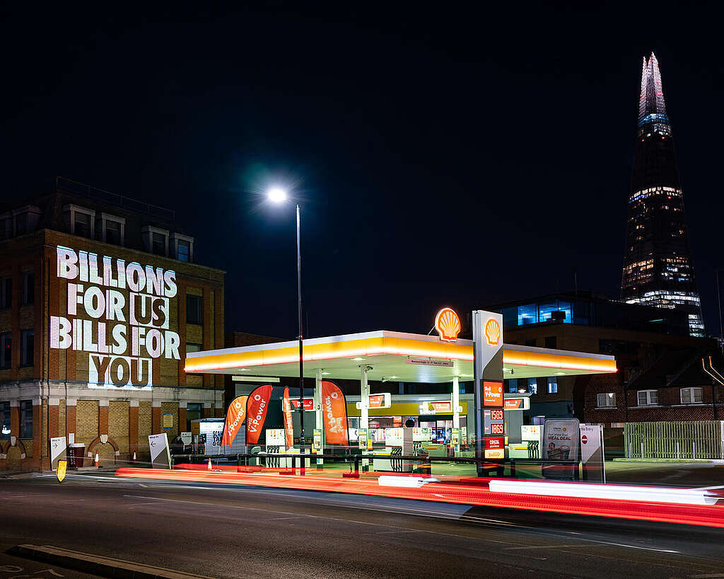 Projection Action in London Exposes Source of Shell's Profits Greenpeace UK activists project the truth about the source of Shell's huge profits onto their global headquarters by the Thames in London as well as next to a Shell petrol station. The projections include the messages