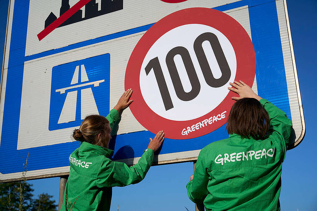 Protest For Speed Reduction on Autobahn in Mecklenburg-Vorpommerania Greenpeace activists protest with signs with a speed limit along the Autobahn at the border entry to Germany in Pomellen in Meckenburg-Vorpommerania. Environmental activists protest for a general speed limit on the autobahn in response to the climate crisis. Through their campaign, the environmentalists highlight the many benefits of a speed limit.