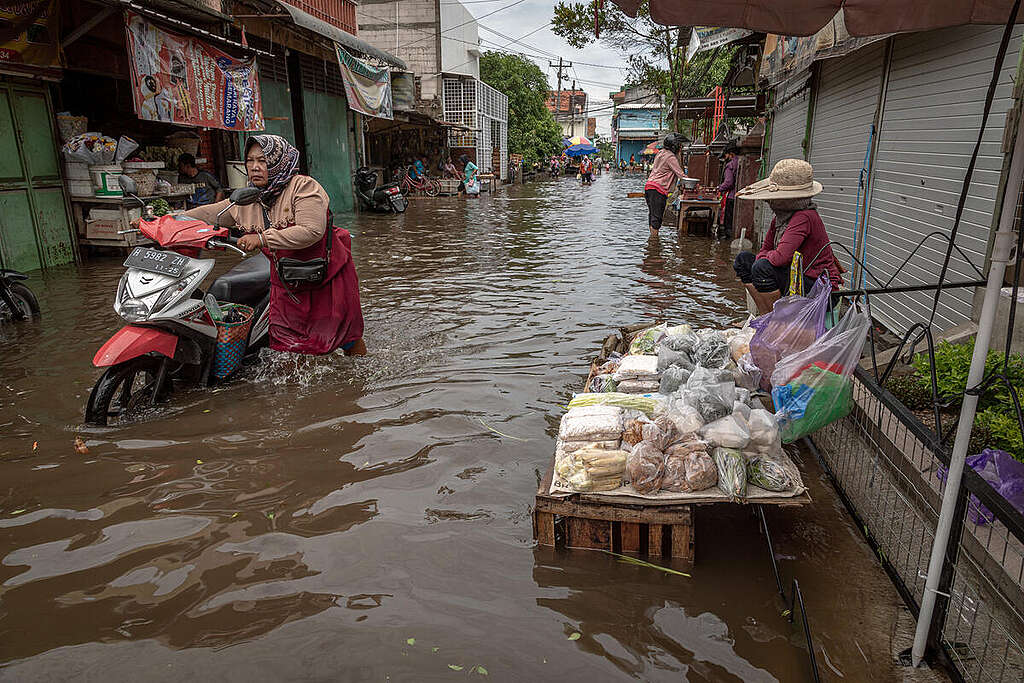 
Flooding Caused by Extreme Weather in Central Java, Indonesia. Merchants wait for buyers amid flooding in the Genuk Traditional Market area, Semarang City, Central Java.