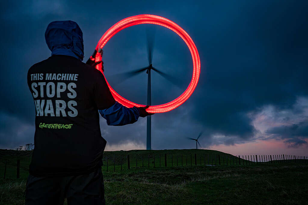 Wind Turbine Peace Sign in New Zealand To celebrate World Wind Day and mark the 100th day of Donald Trump's war on Iran, which has seen oil prices spike and cost of living rise worldwide as a result, Greenpeace activists visited Te Uku wind farm near Raglan in New Zealand and transformed wind turbines into peace signs with the message