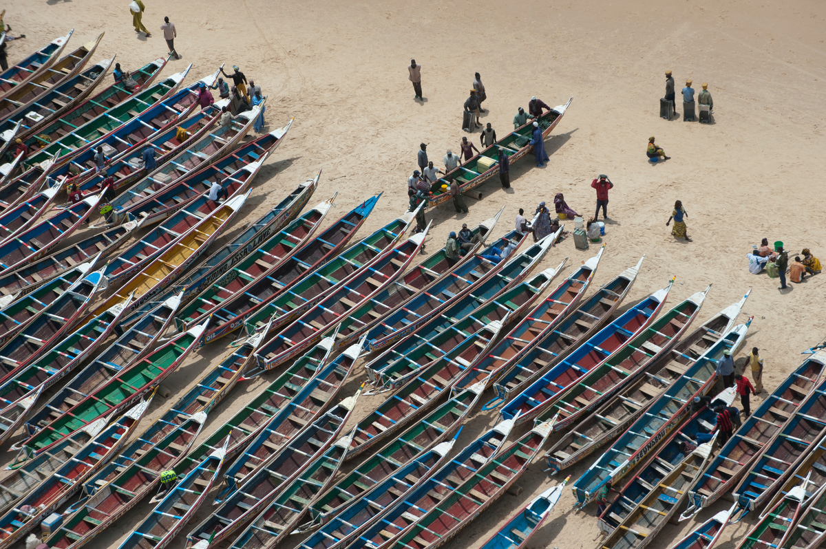 Artisanal Fishing Pirogues in Senegal Artisanal fishing pirogues on a beach in Kayar. Greenpeace is campaigning in West Africa for the establishment of a sustainable, low impact fisheries policy that takes into account the needs and interests of small-scale fishermen and the local communities that depend on healthy oceans.