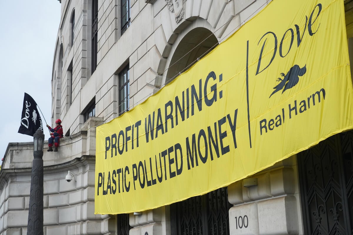 On the eve of Unilever's profits announcement Greenpeace UK scale the company's HQ by Blackfriars Bridge in London and unveil a huge banner reading PROFIT WARNING - Plastic Polluted Money.  Dove's owners Unilever have risen into the top three of Break Free From Plastic's 2023 annual brand audit of global corporate plastic polluters. This comes a matter of months after Unilever were revealed to be the biggest seller of some of the worst polluting packaging - multi-layered plastic sachets.