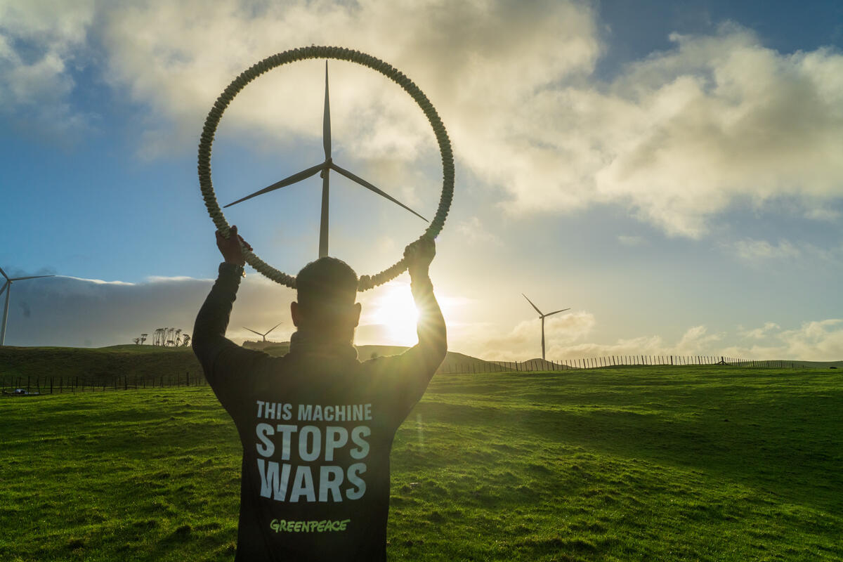Wind Turbine Peace Sign in New Zealand To celebrate World Wind Day and mark the 100th day of Donald Trump's war on Iran, which has seen oil prices spike and cost of living rise worldwide as a result, Greenpeace activists visited Te Uku wind farm near Raglan in New Zealand and transformed wind turbines into peace signs with the message