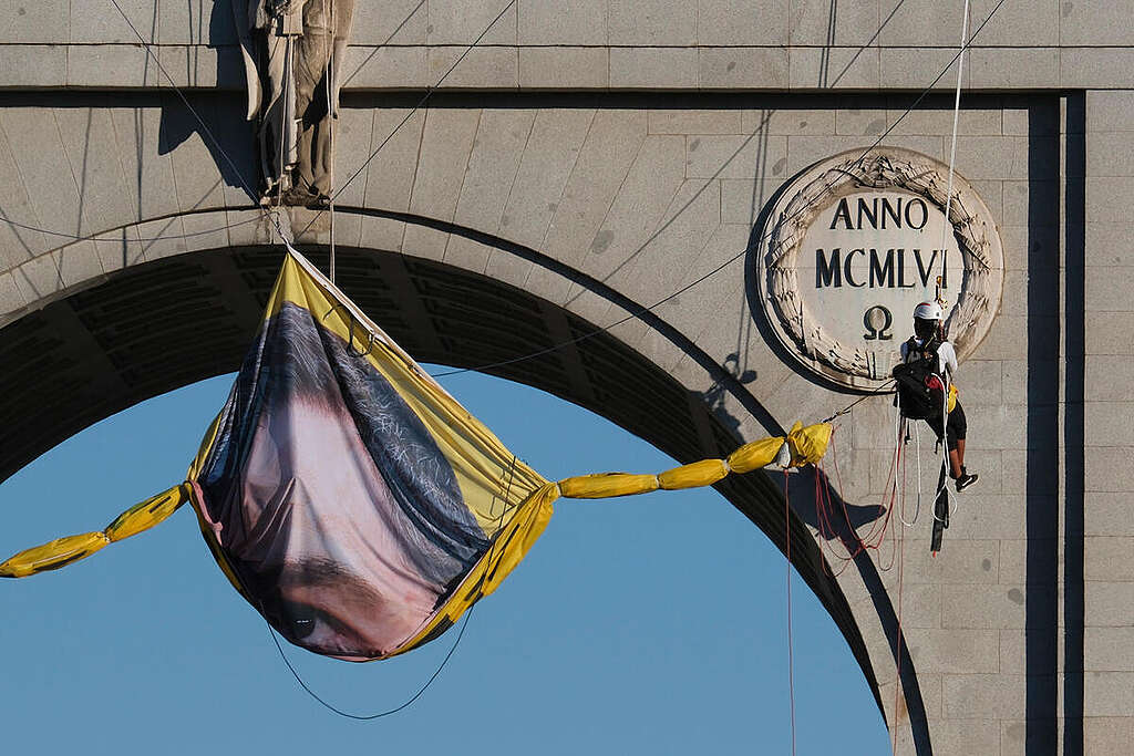 Greenpeace Spain activists displayed a banner in Madrid on the Moncloa Arch with the message: 