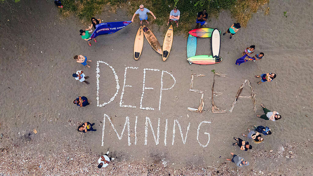 Paddle out participants form the words 
