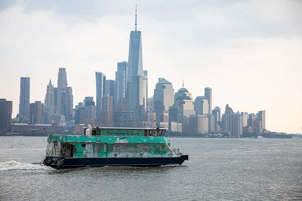 Wildfire Smoke Envelops New York Area A ferry passes by the New York skyline that is enveloped in wildfire smoke shortly before a rain shower. Most of the Tri-State Area, including New York City, is under an air quality alert July 15 and 16 due to smoke from Canadian wildfires. The alert is also due to ground-level ozone. New Yorkers can expect to see smoke over the five boroughs during the mid-morning hours. New York City is in a Code Red as heat indices are expected to reach triple digits. Officials from the city's emergency management department said the air quality is unhealthy for sensitive groups. Children, older adults and those who are pregnant or have other medical conditions are advised to limit time outside. © Tim Aubry / Greenpeace