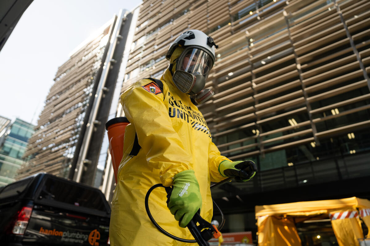 Fonterra Nitrate Emergency Quarantine Zone Protest in Auckland Greenpeace activists in Auckland set up a decontamination tent outside New Zealand's largest dairy company, Fonterra, and poured 2 metric tonnes of slime around the building. This represented the toxic slime found in rivers and lakes from e-coli and nitrate contamination, and prevented shareholders from walking through main entrances for their annual meeting.The organisation was protesting over nitrate contamination in lakes, rivers and drinking water, which is posing a risk to human health. It is calling on Fonterra to reduce the dairy herd size and transition away from intensive dairying towards ecological farming.