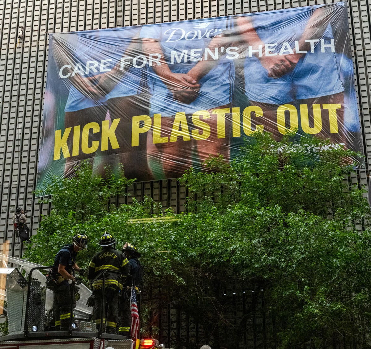 Greenpeace USA activists unfurl a 50-foot banner outside Unilever's USA headquarters calling on Dove, its personal care brand, to kick plastic out of its packaging with the message: 