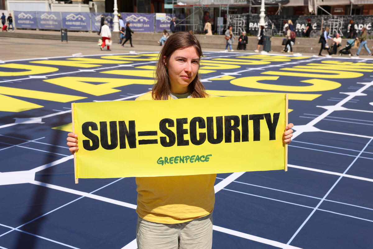 Activists Promote Security and Affordability of Solar Energy in Zagreb In Croatia, Greenpeace activists transformed part of central Zagreb square into a sun, next to a large banner: