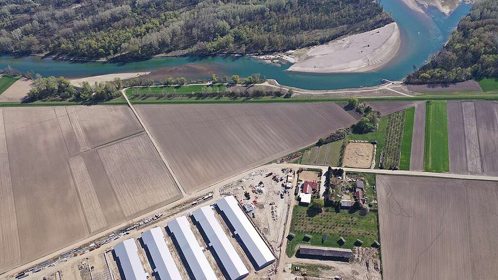 The new megafarm being built next to the Drava river, drone photo, 2026.