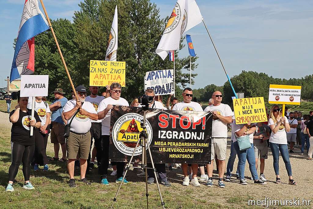A group of people gathering in protest to protect their land