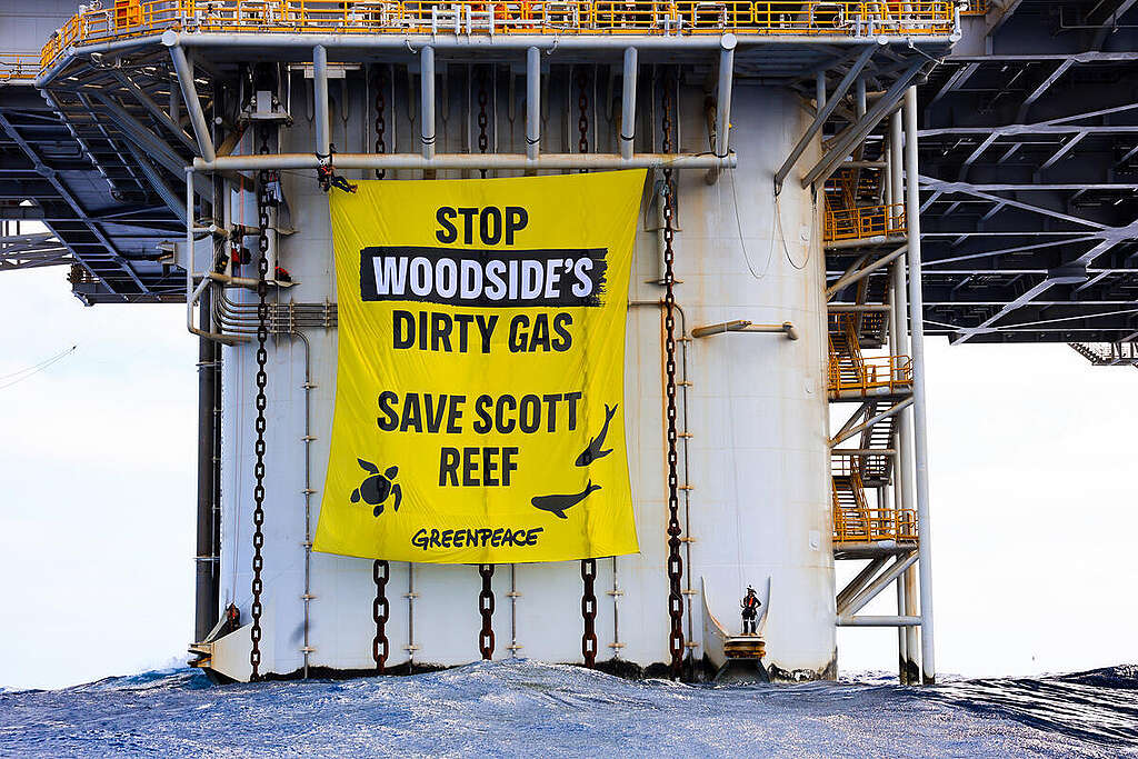 Massive Banner Action at Woodside's Scarborough Gas Platform off Western Australia Greenpeace activists deploy massive 14m x 12m banner that reads 'Stop Woodside's Dirty Gas. Save Scott Reef.' upon a Floating Production Unit at Woodside's Scarborough gas project over 200km off the coast of Exmouth in peaceful protest of Woodside's reckless plans to drill for oil and gas at Scott Reef.