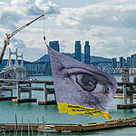 #WeAreWatching is a monumental flag with a giant eye composed of thousands of portraits from around the world, unfurled from a 10-storey crane as government representatives are gathering for the the fifth and final Intergovernmental Negotiating Committee (INC5) meeting for a Global Plastics Treaty.

Greenpeace is collaborating with #WeAreWatching by artist Dan Acher to demand bold action. 

From November 25 to December 1, 2024 world leaders will meet in Busan, South Korea for the fifth and final round of negotiations of the Global Plastics Treaty - a once-in-a-generation opportunity to solve the plastics crisis.