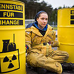 Greenpeace activists protest in front of  nuclear fuel element production plant ANF in Lingen. The environmental activists chain themselves with neck locks to the entrance gate and link their arms to yellow nuclear waste barrels. Greenpeace activists demand to stop delivery of nuclear fuel from Germany to outdated nuclear power plants in Europe, like Fessenheim in France and Thiange and Doel in Belgium. Banners in German, French, Dutch and English read: "Stop Nuclear Power in Europe".
Greenpeace Aktivisten protestieren mit gelben Atommuellfaessern vor der Brennelementefabrik ANF (Areva) in Lingen. Die Umweltschuetzer ketten sich an das Tor der Anlage und fordern den Stopp von Brennstofflieferungen aus Lingen an ueberalterte Atomkraftwerke in Europa.
Banner in Englisch, Franzoesisch und Deutsch lauten:"Stop nuclear power in Europe".