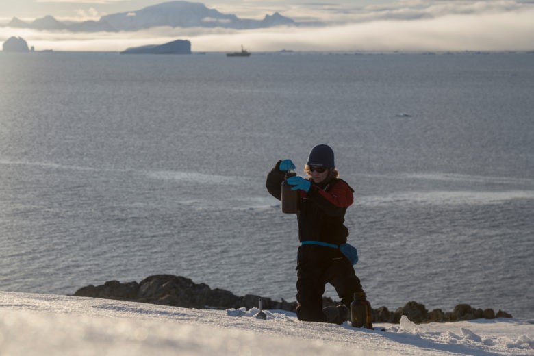 Madder Cliffs, Joinville Island. Antarctica.Sandra Schoettner, marine biologist and oceans campaigner with Greenpeace Germany and Josh Ingram from Greenpeace ship Arctic Sunrise doing snow sampling to investigate the presence of persistent organic pollutants like PFCs (per- and polyfluorinated chemicals) in the Antarctic environment. PFCs are widely used in industrial processes and products. The outdoor industry applies them for waterproof gear like jackets and shoes. Greenpeace has already performed this kind of sampling in other remote and seemingly pristine places in China, Russia, Turkey, Scandinavia, the Alps, and Patagonia.