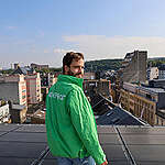 Greenpeace employees take part in the installation of solar panels on the rooftop of the Greenpeace Luxembourg office.