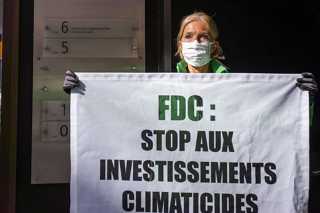 Greenwashing Action at National Pension Fund Headquarters in Luxembourg. © Sara Poza Alvarez / Greenpeace