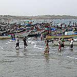 TOPSHOT - Yemeni fishermen gather by their boats as they return from fishing in the Red Sea coastal Khokha district of Yemen's western province of Hodeida, on July 12, 2021. (Photo by Khaled Ziad / AFP) (Photo by KHALED ZIAD/AFP via Getty Images)