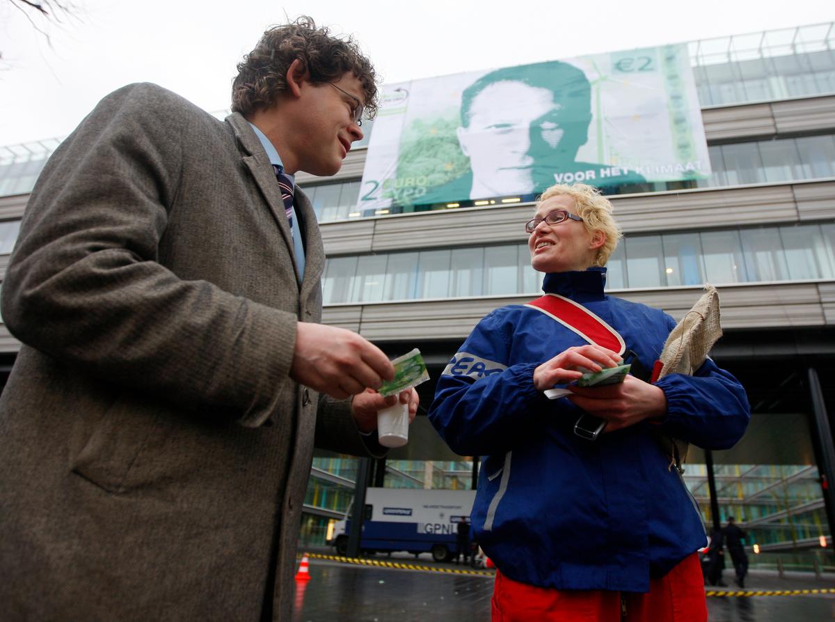Forests & Climate Action with Euros Banner in The Hague. © Greenpeace / Cris Toala Olivares