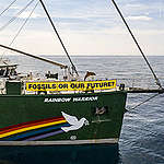 Rainbow Warrior with banner reading "Fossils or our future?" in the foreground, the oil rig Dan Bravo in the background. 
Greenpeace Denmark activists prepare to carry out an action in the Danish North Sea, to demand an immediate ban on all further oil and gas exploration in Denmark, followed by a complete phase out of domestic fossil fuel production and a massive expansion of clean offshore wind power.
Unless the Danish government is brave enough to ban the search for new oil and gas in Denmark, it will never be the green frontrunner it claims to be.