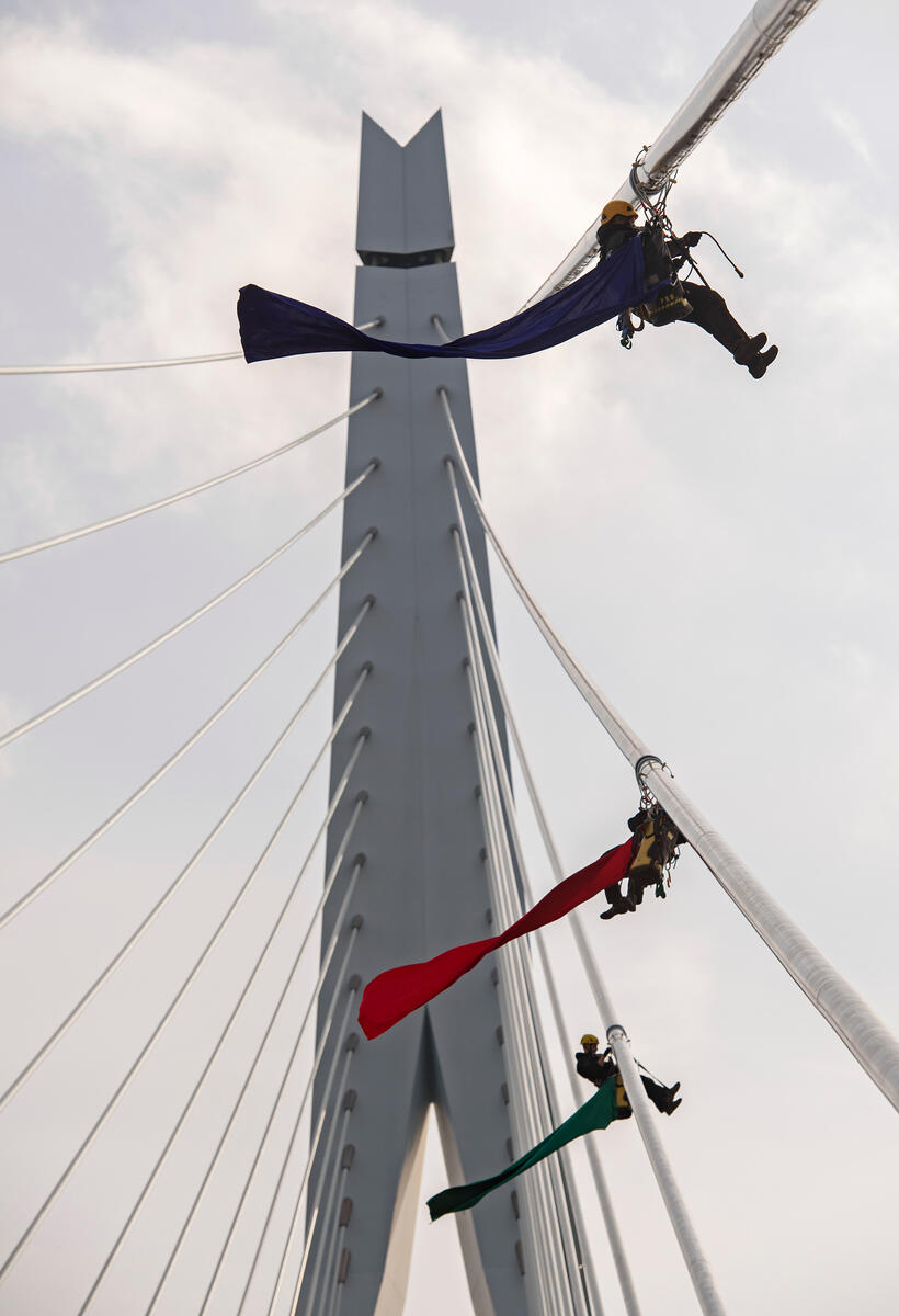 Four activists from Greenpeace Netherlands climb the Erasmus Bridge in Rotterdam