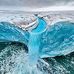 Roie Galitz, wildlife photographer and Greenpeace Israel's ambassador took these breathtaking photos. Bråsvellbreen, a majestic and sprawling ice feature in the Svalbard archipelago, stands as one of the longest glacier fronts in the Arctic. Stretching impressively across the landscape for 45km, this glacier is part of the larger Austfonna ice cap, which paints a stunning picture of craggy ice melting into the cold waters below. 
Known for its dramatic calving events and stark beauty, Bråsvellbreen is a vivid reminder of nature's power and fragility. As climate change poses increasing threats, the glacier serves as both a breathtaking spectacle and a critical indicator of environmental shifts in one of the Earth's most sensitive regions.